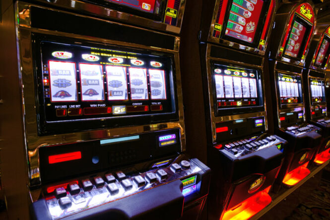 A row of slot machines insude a casino